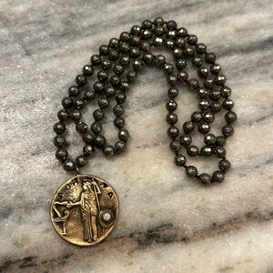 Beaded necklace with gold plated Greek pendant